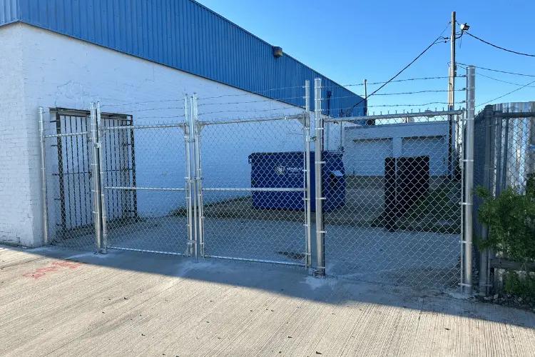 Commercial security chain link fence with a barbed top installed in Oklahoma City