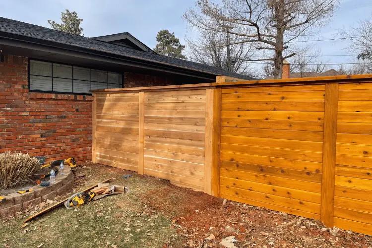Cedar wood privacy fence with post-and-beam construction in Oklahoma City