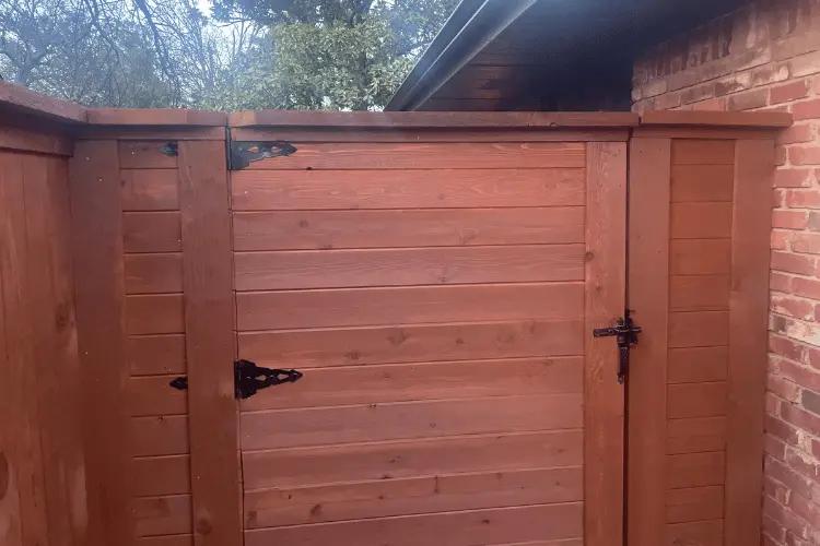 Tall cedar privacy fence enclosing a backyard in the Oklahoma City metro