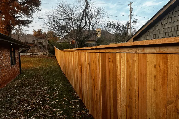 Six-foot cedar cap-and-trim privacy fence in the Oklahoma City metro
