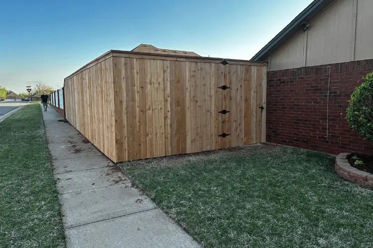 Cap and trim cedar privacy fence installed in Oklahoma City