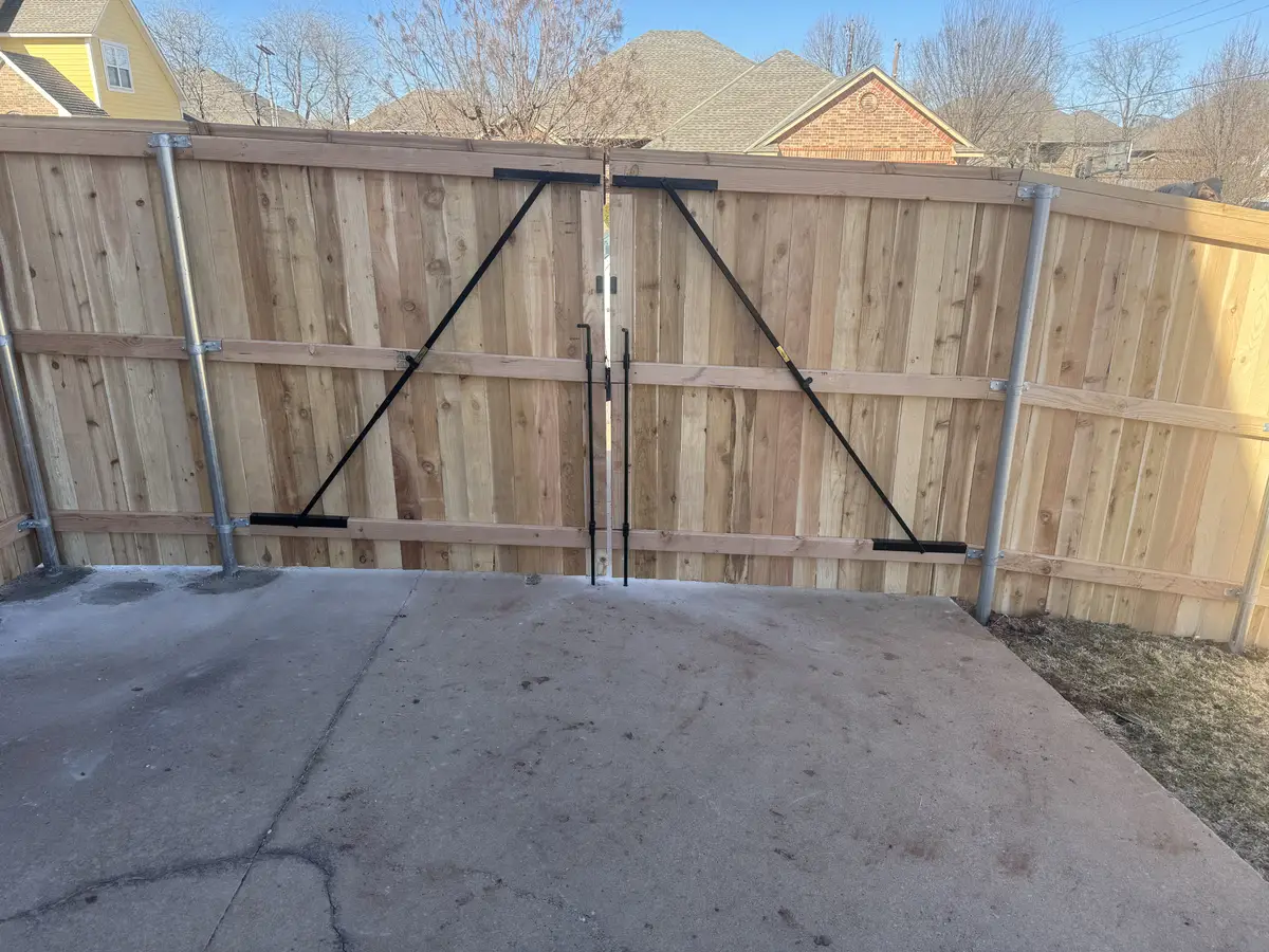 Cedar double drive gate on a welded steel frame in the Oklahoma City metro