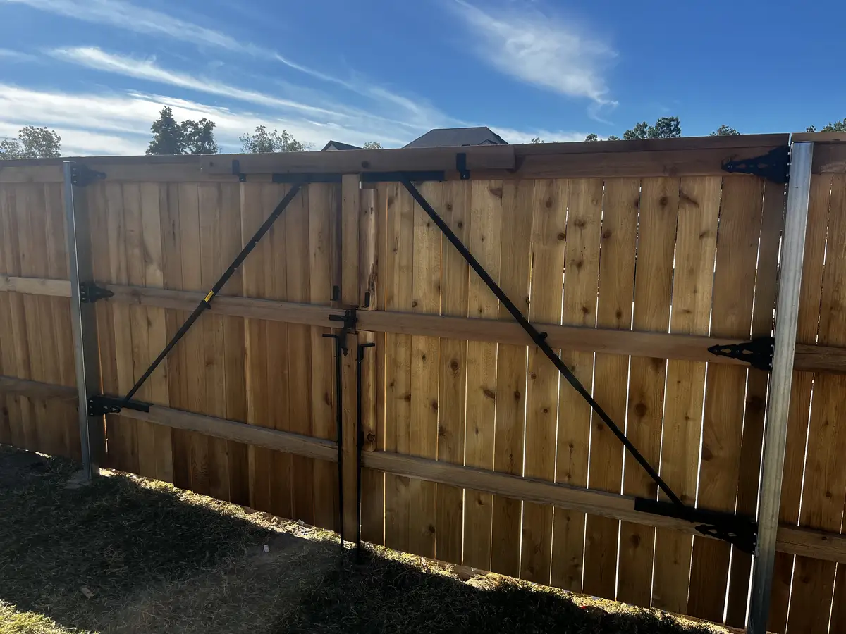 Cedar privacy fence with galvanized steel posts and a braced corner in Oklahoma City