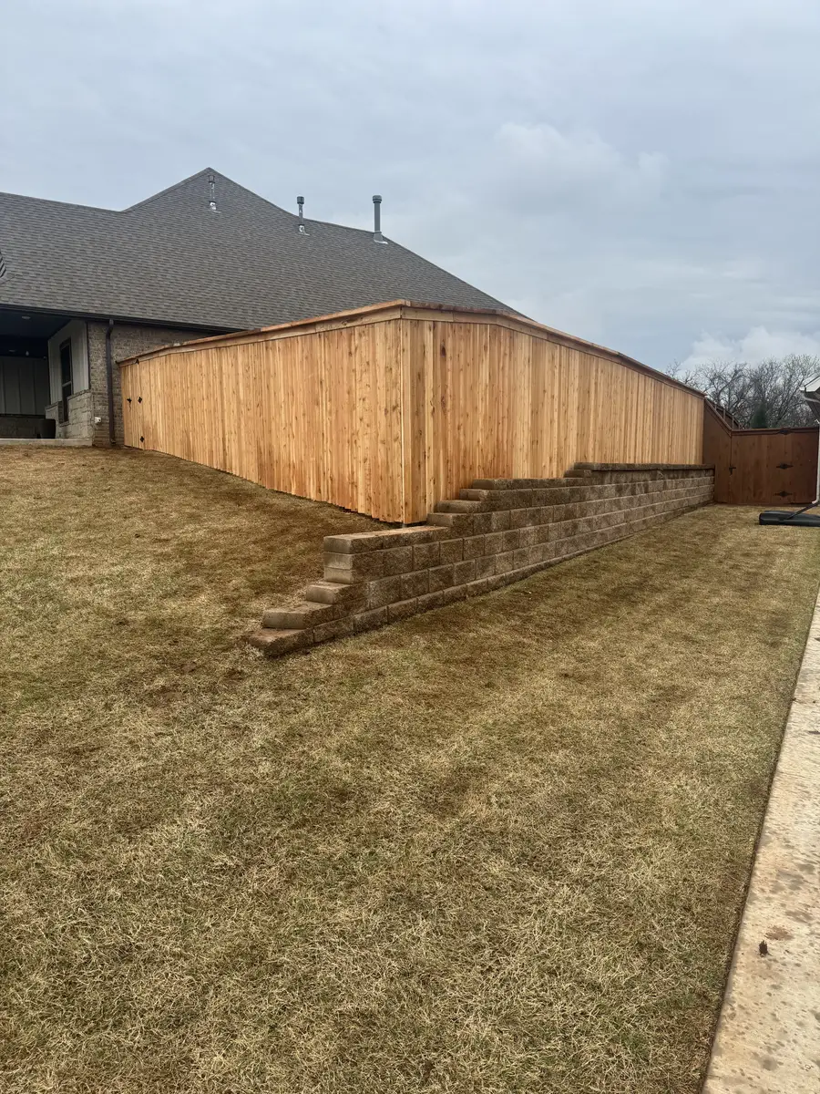 Cedar privacy fence stepped down a sloped Oklahoma City yard