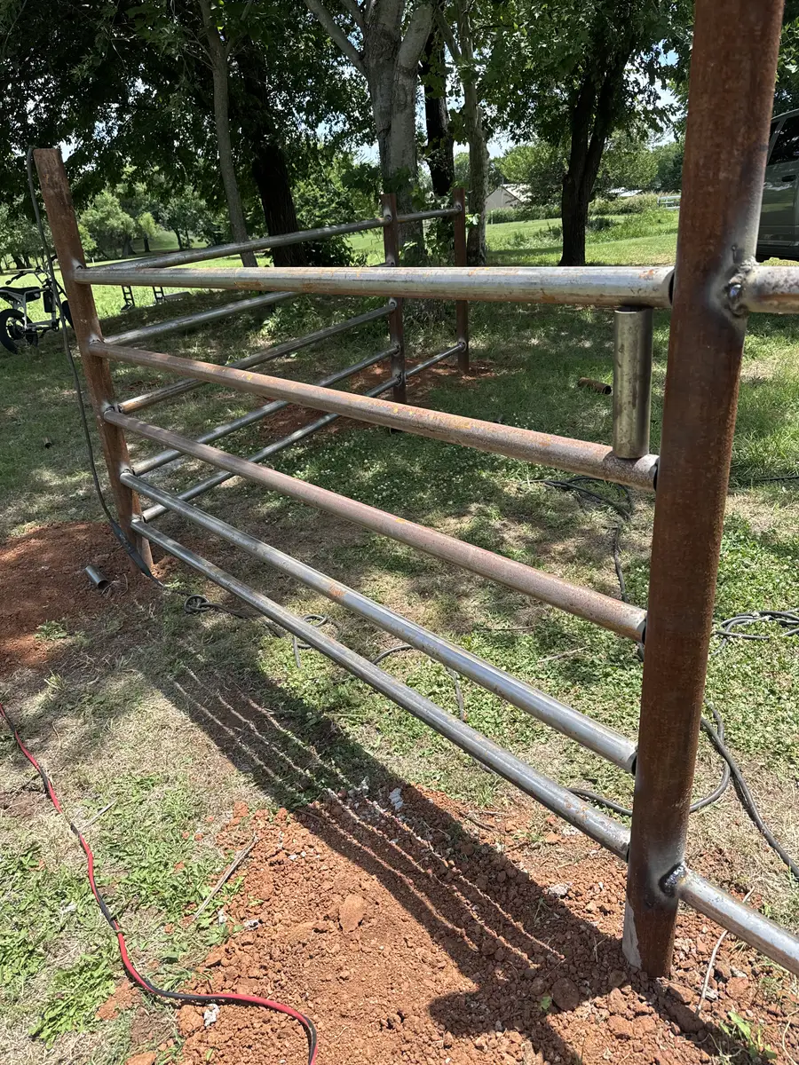Galvanized pipe rail farm gate on an Oklahoma acreage