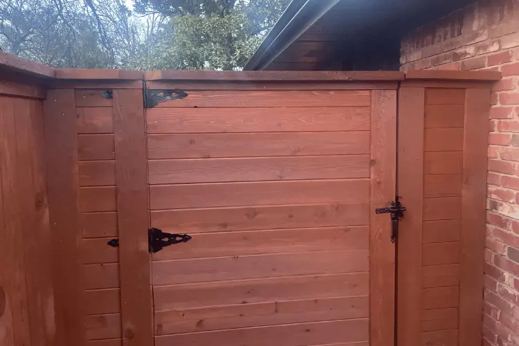 Tall cedar privacy fence enclosing a backyard in the Oklahoma City metro
